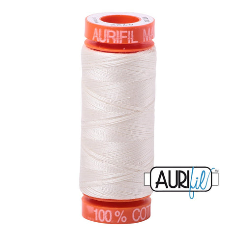 small spool of aurifil off white thread